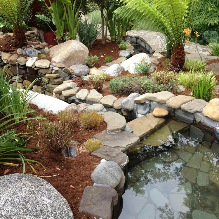Natural stone pond & flagstone bridge