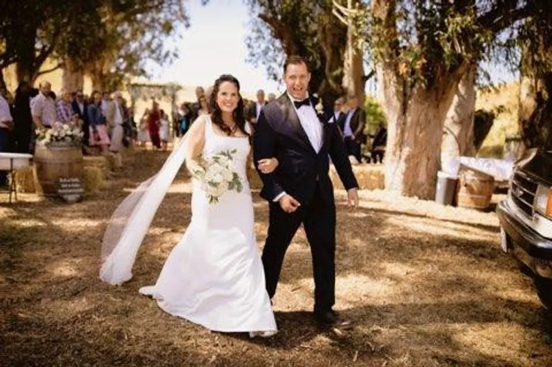An oak-lined aisle framed by wine barrels at Glenn Ranch