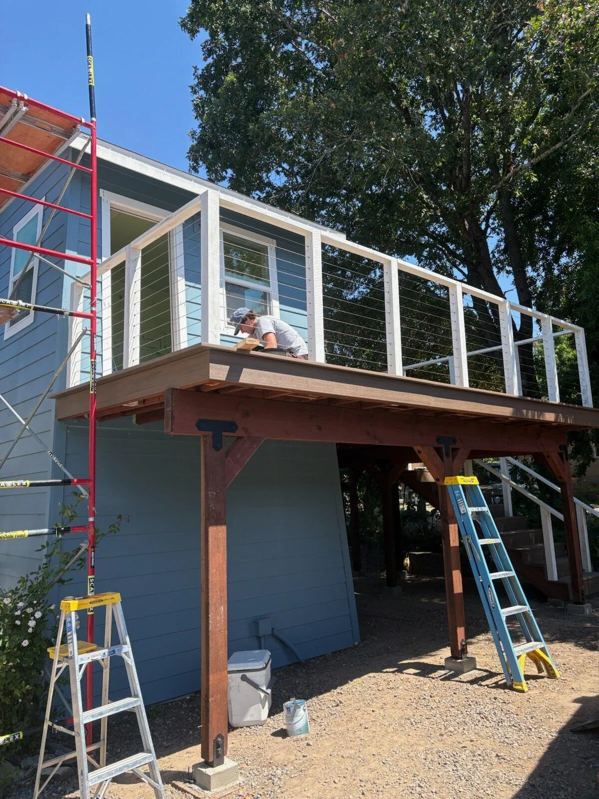 The same deck mid-build, framing and ladders in place