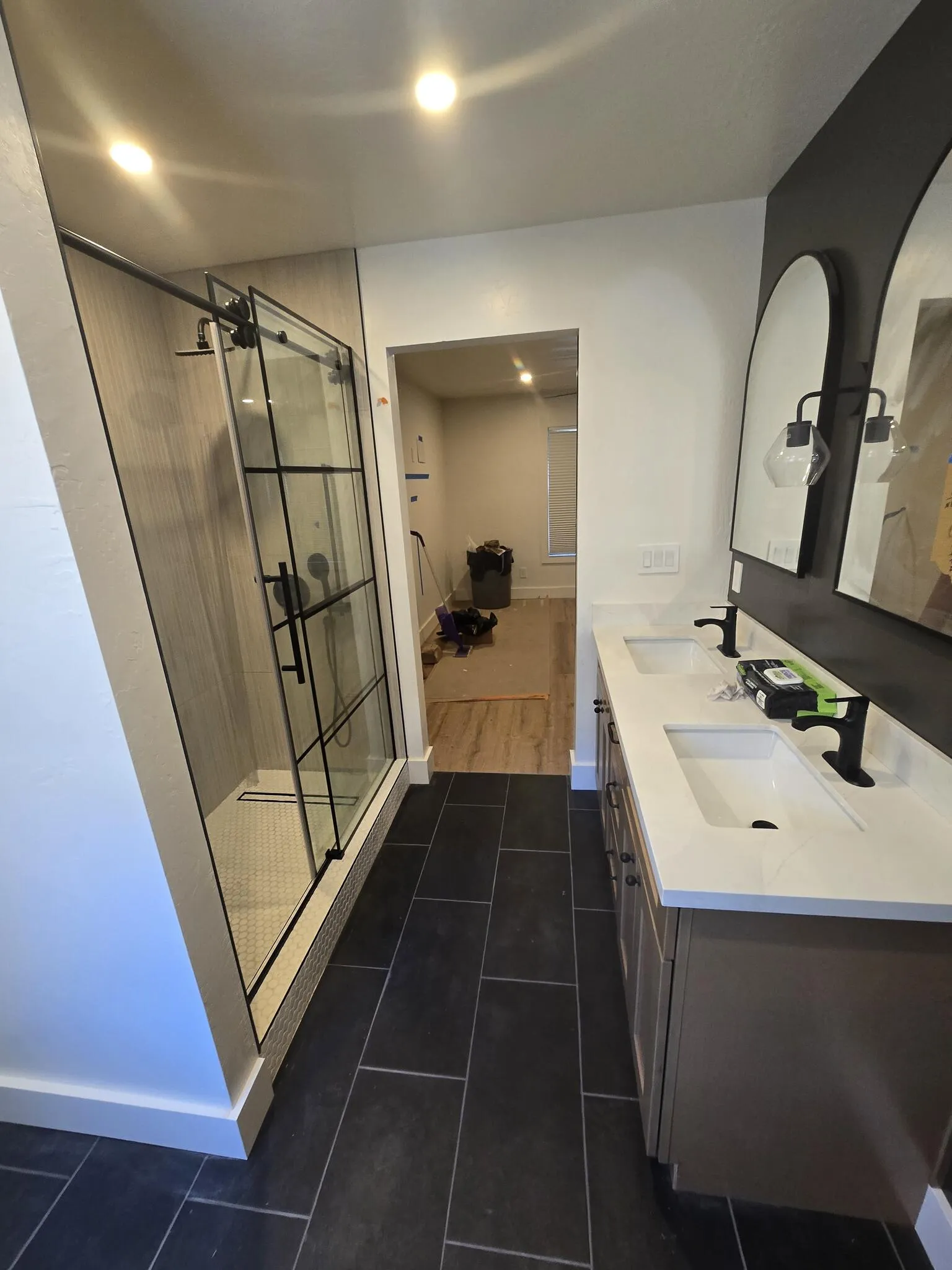 Remodeled bathroom with new vanity, mirror and finishes