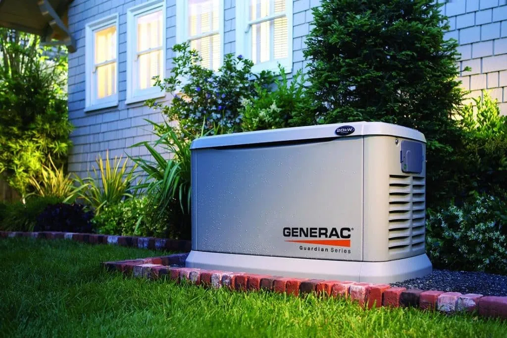 A Generac Guardian Series standby generator installed beside a home